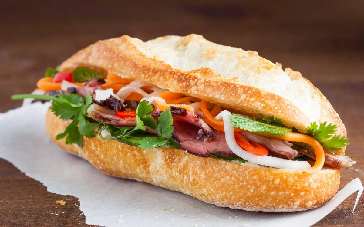 Banh mi Vietnamese sandwich with fresh vegetables and meat